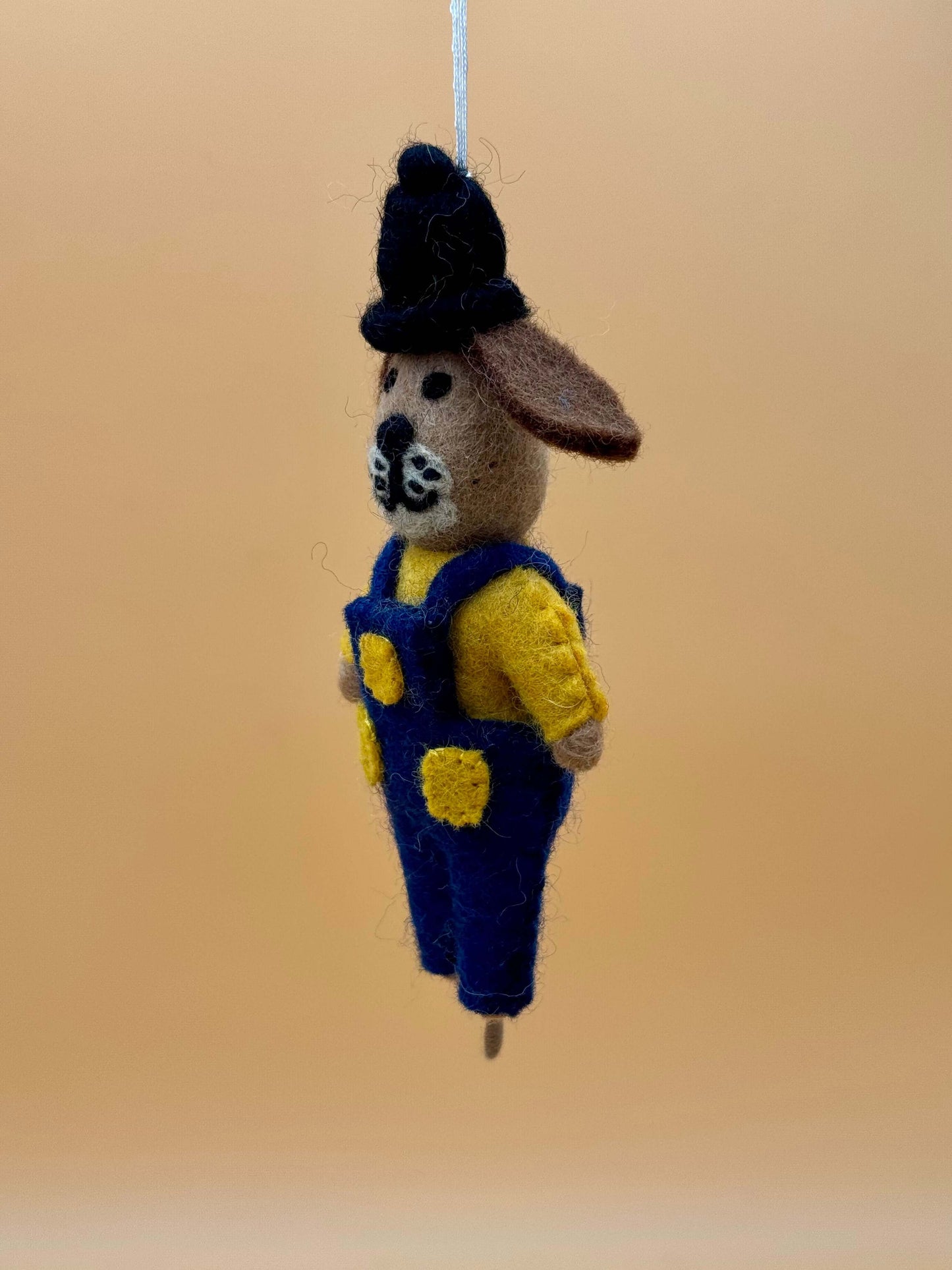 Handmade felt dog keychain featuring a ticket inspector in blue overalls and a hat, unique decorative item.