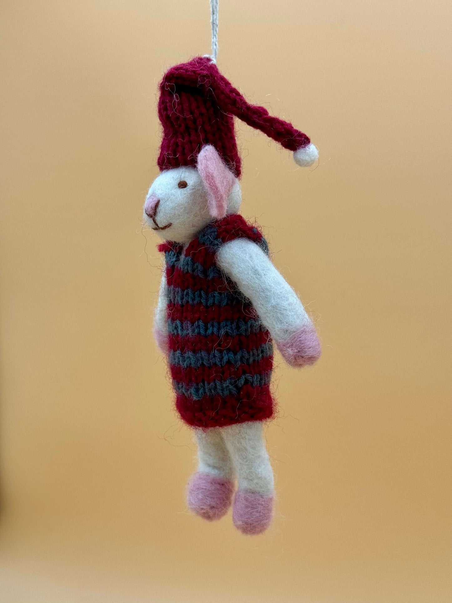 Handmade felt mouse keychain wearing a red and blue sweater and hat, perfect for unique gifting.
