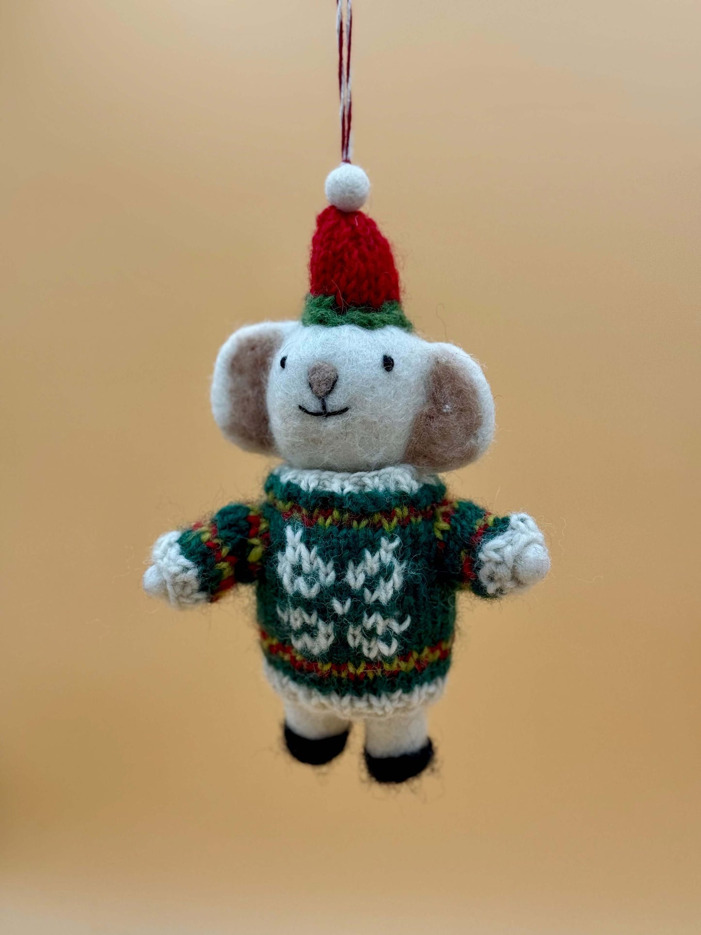 Handmade felt keychain of a Christmas mouse wearing a sweater and hat, perfect for festive decor. View details for Filzanhänger.