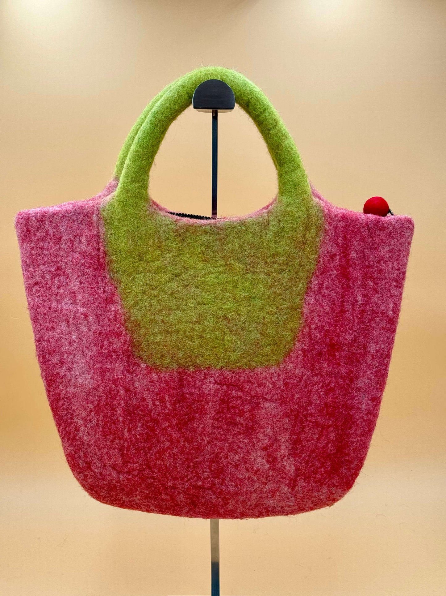 Handmade large felt bag in pink and green design, perfect for carrying books and everyday items.