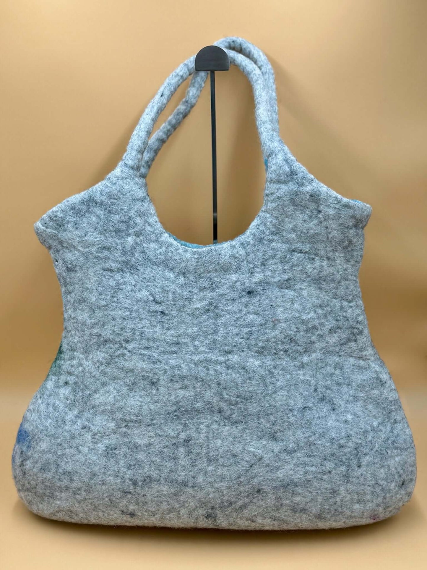Handmade XL shoulder felt bag in gray material, perfect for carrying essentials like books and laptops.