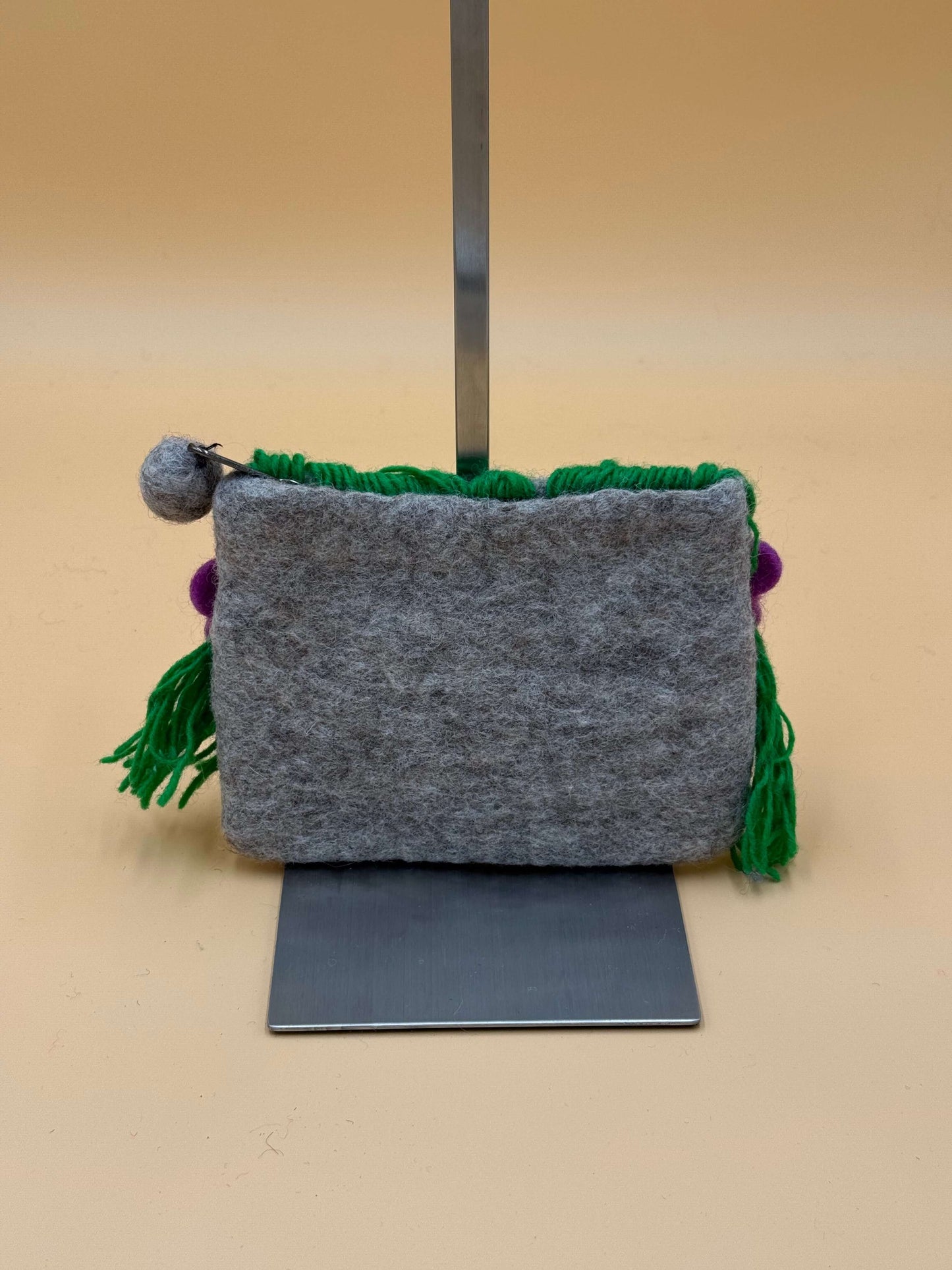 Handmade grey and green felt wallet bag Size M for girls, featuring colorful pom poms and tassels.