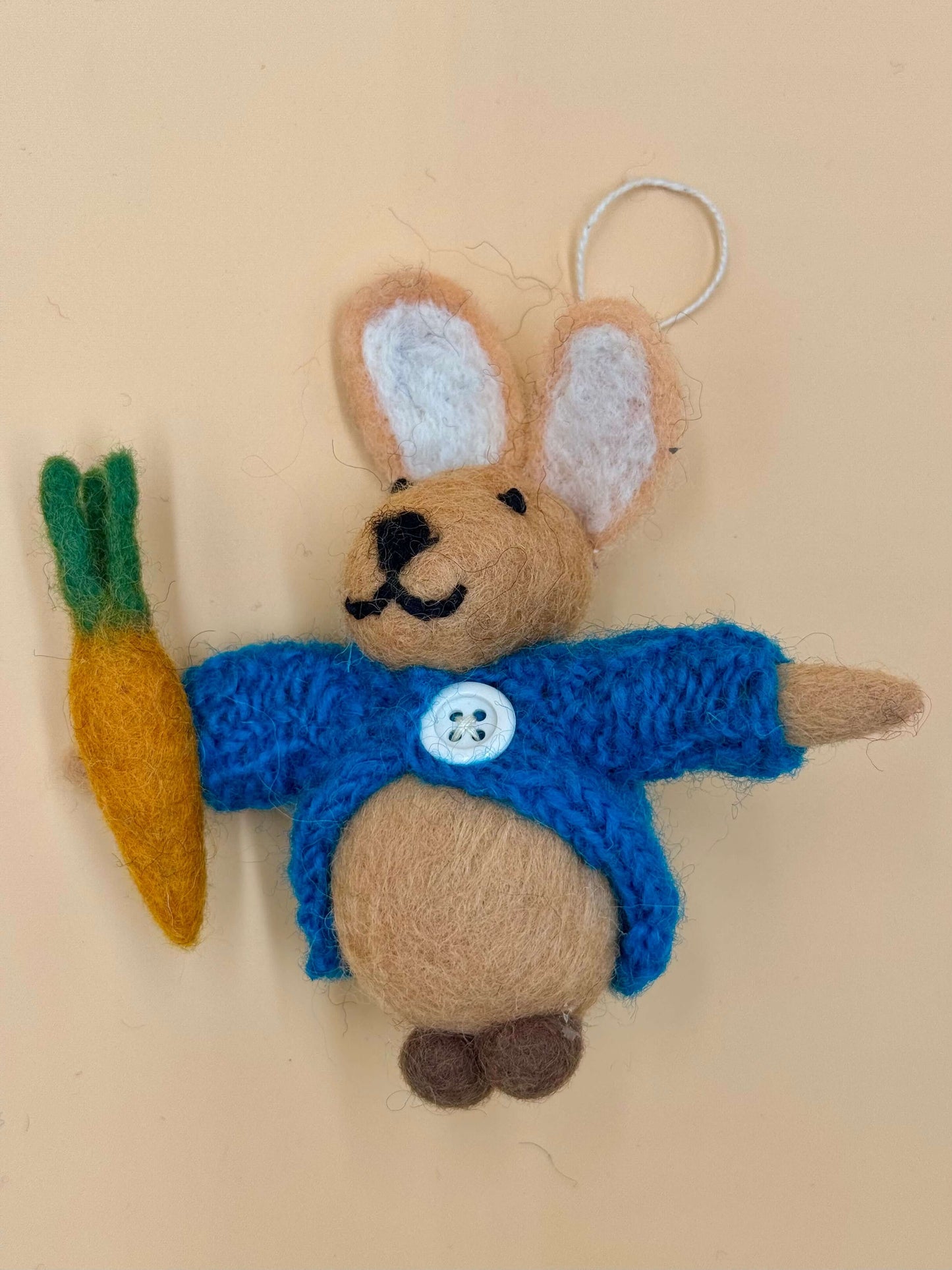 Handmade felt rabbit keychain with carrot, featuring blue clothing and unique design, perfect for gifting.
