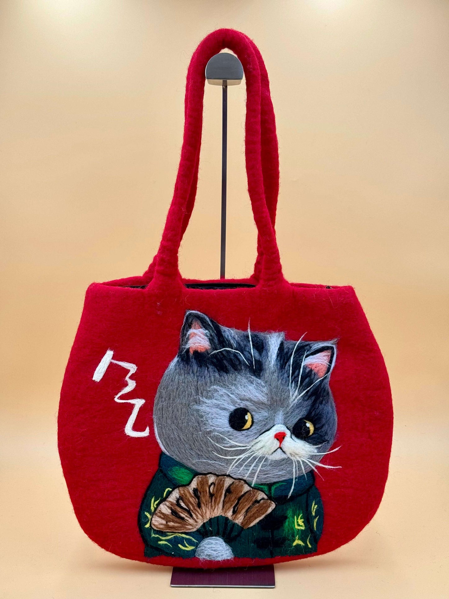 Handmade red felt tote bag featuring an embroidered Kungfu cat design. Perfect for carrying essentials.