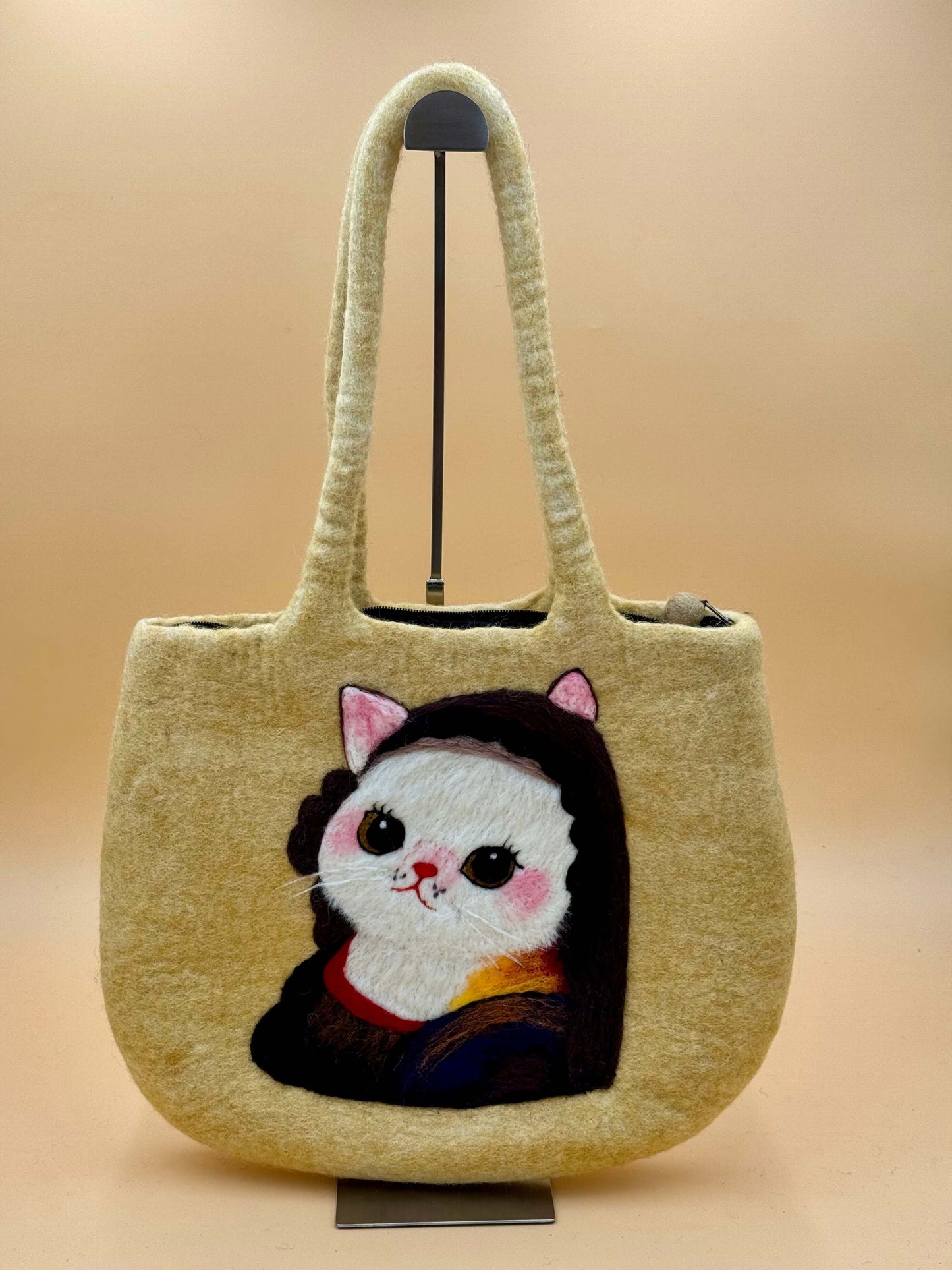 Handmade yellow felt shoulder bag featuring a cute cat design inspired by the Mona Lisa, perfect for everyday use.