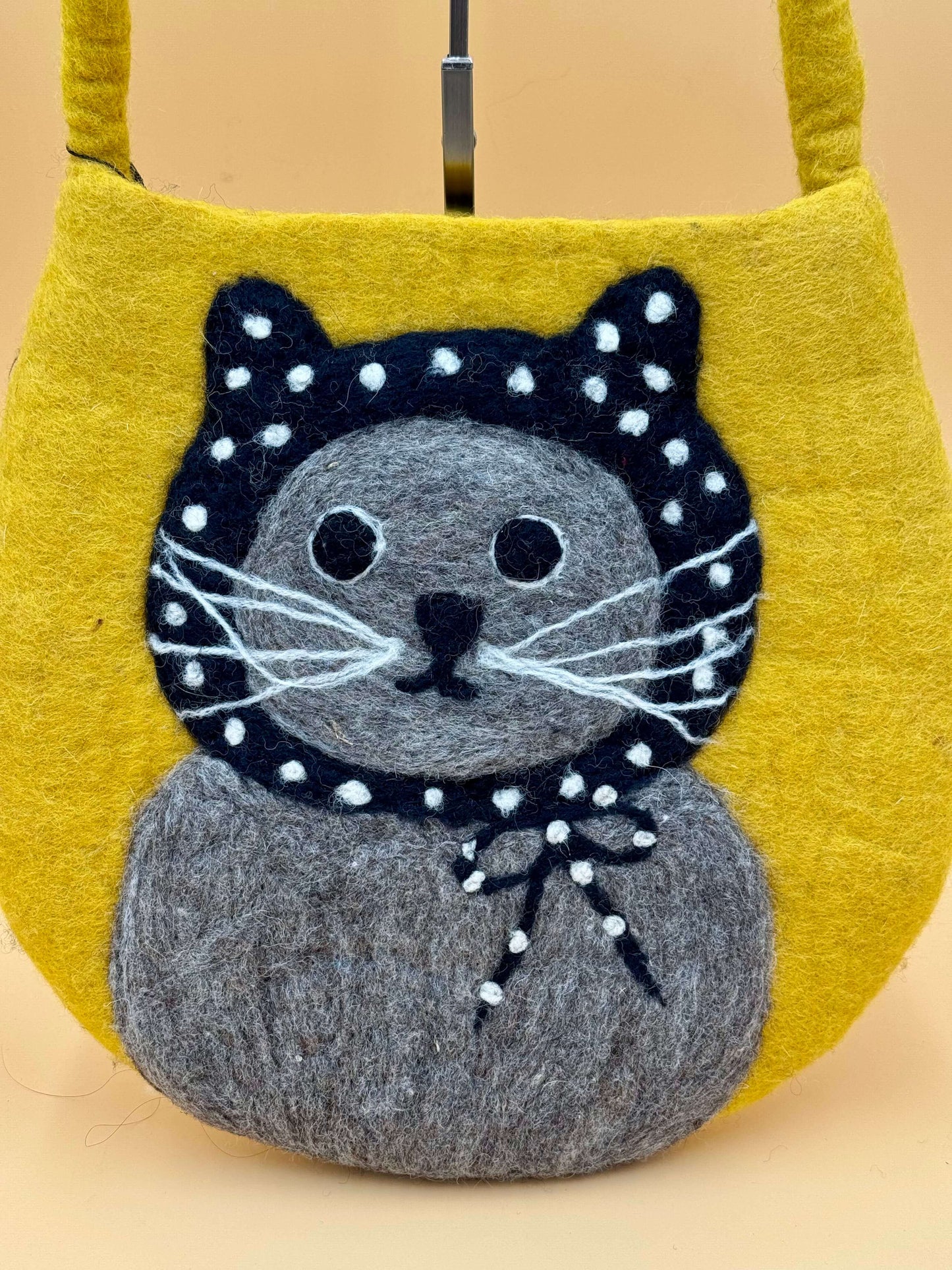 Handmade yellow felt shoulder bag featuring a cute cat with a polka dot headscarf, perfect for everyday use.