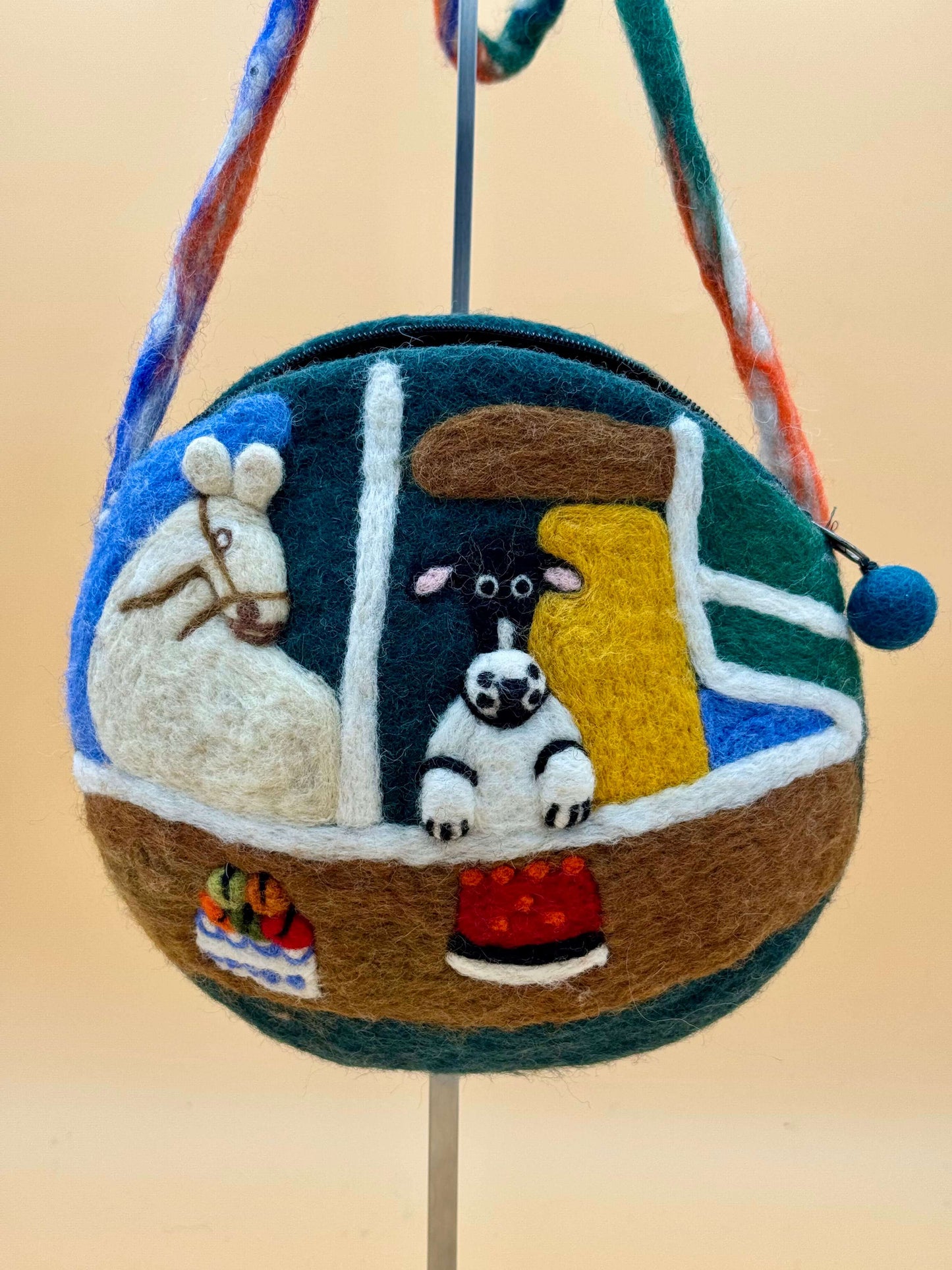 Handmade wool felt crossbody bag featuring horse and zebra design, size S, perfect for cosmetics and essentials.