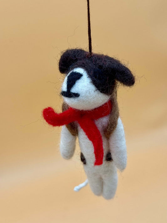 Handmade felt dog keychain with a red scarf, perfect for school. Unique and crafted from 100% wool.
