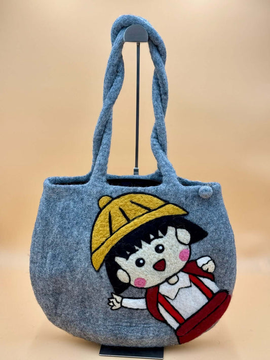 Handmade gray felt tote bag with colorful character design, ideal for carrying everyday essentials.