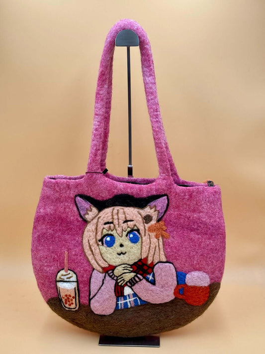 Handmade pink felt shoulder tote bag featuring an artistic character design and spacious layout.
