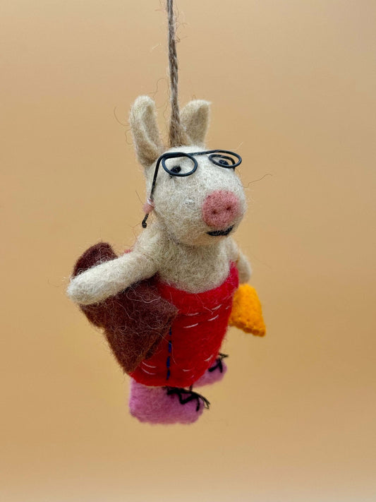 Handmade beige and brown felt pig keychain with glasses, dress, bag, and book. Unique felt accessory.