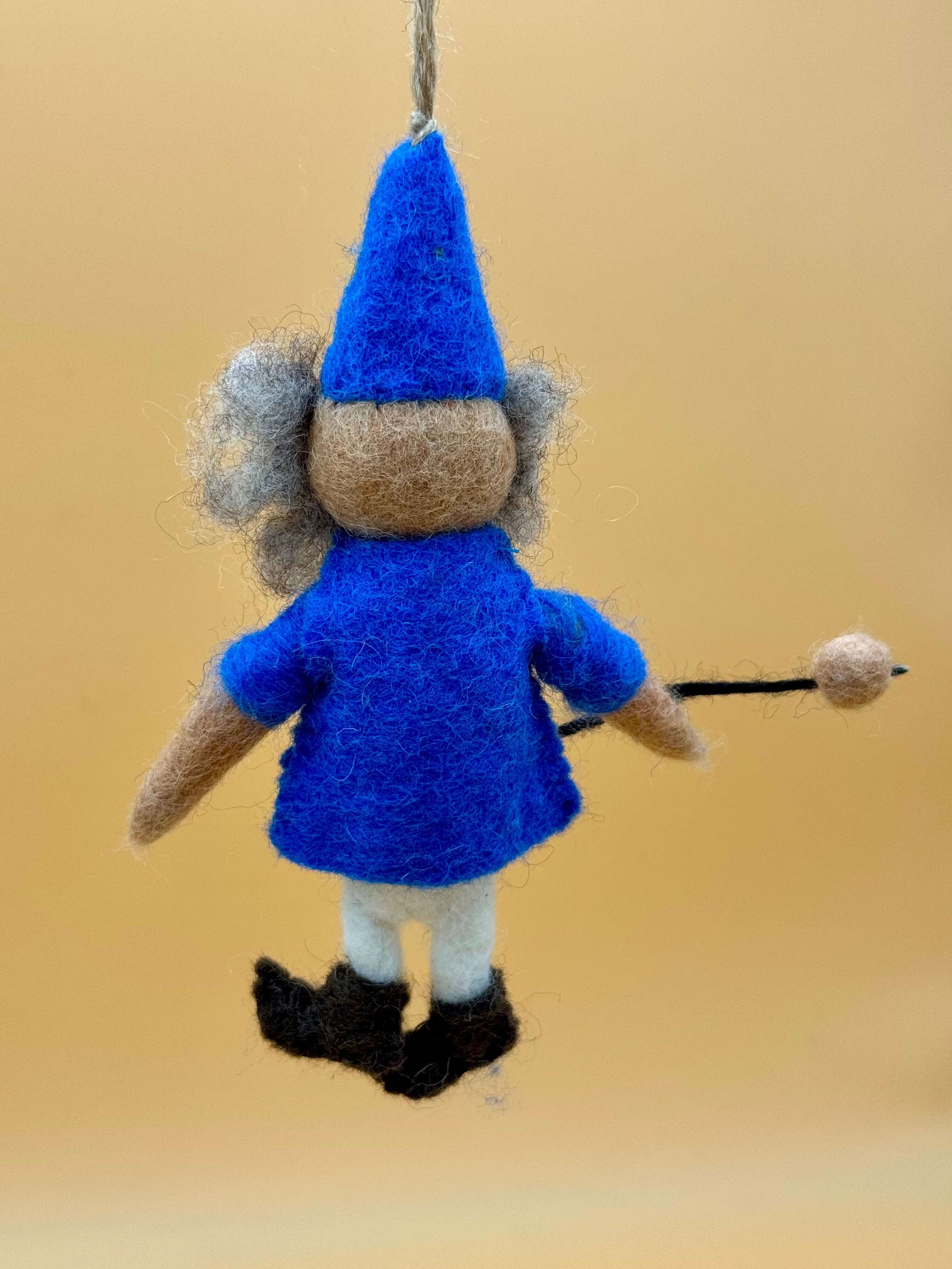 Handmade blue felt keychain featuring a wizard with glasses and a magic wand, unique and crafted from 100% wool.