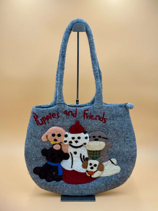 Handmade gray felt shoulder bag with puppy design and the words 'Puppies and Friends' embroidered.
